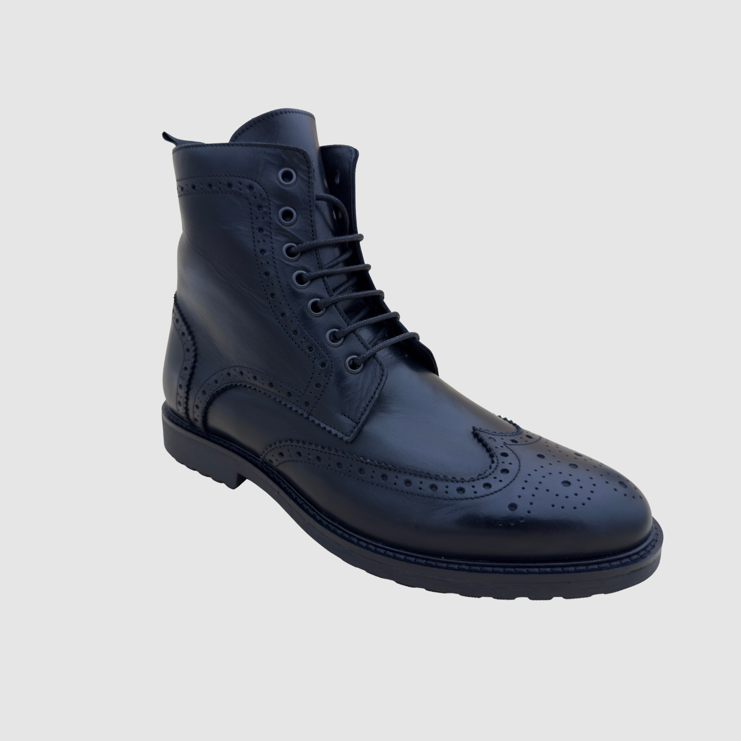 Détail cuir bottines brogue homme noir finition artisanale