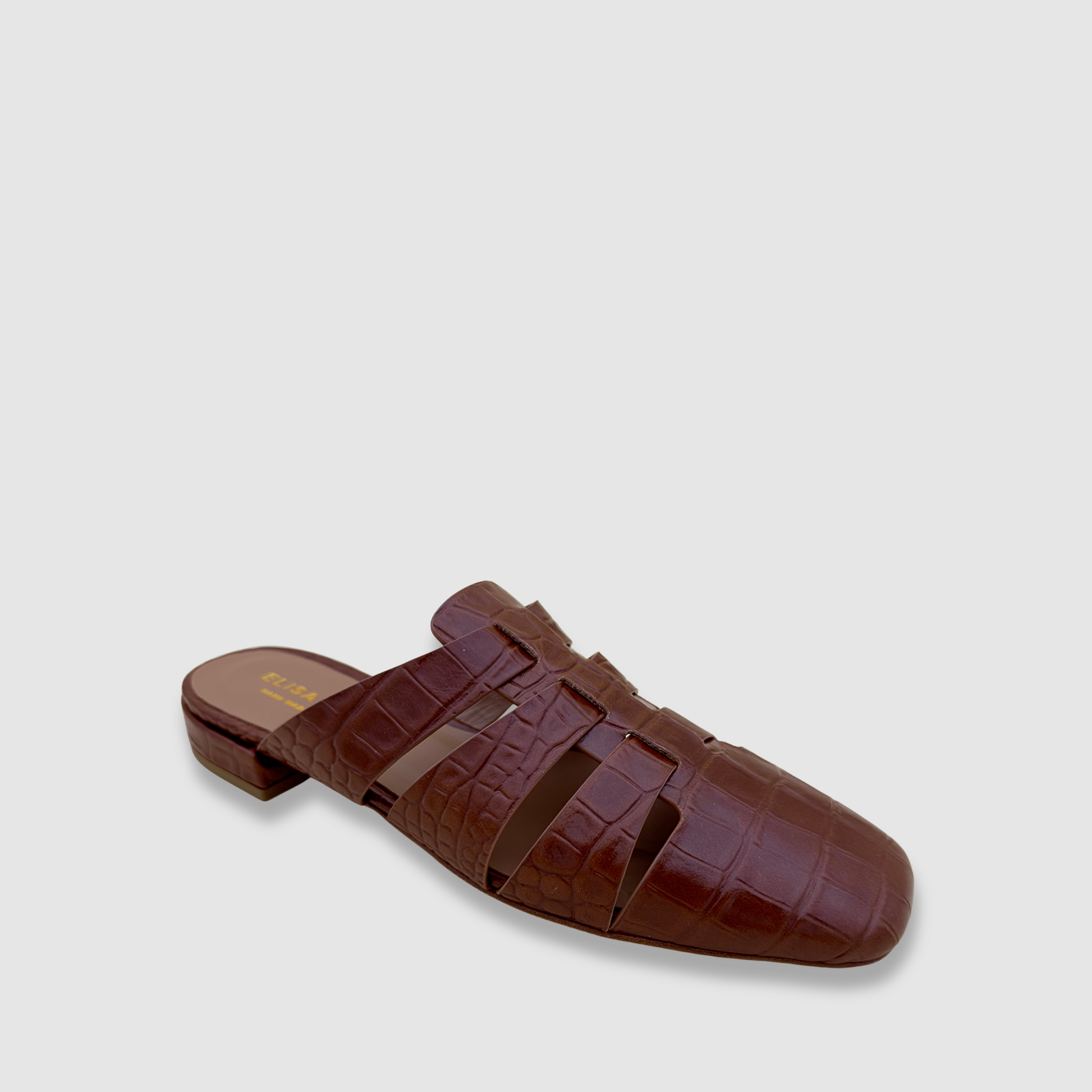 Mules cuir marron effet croco profil silhouette raffinée été